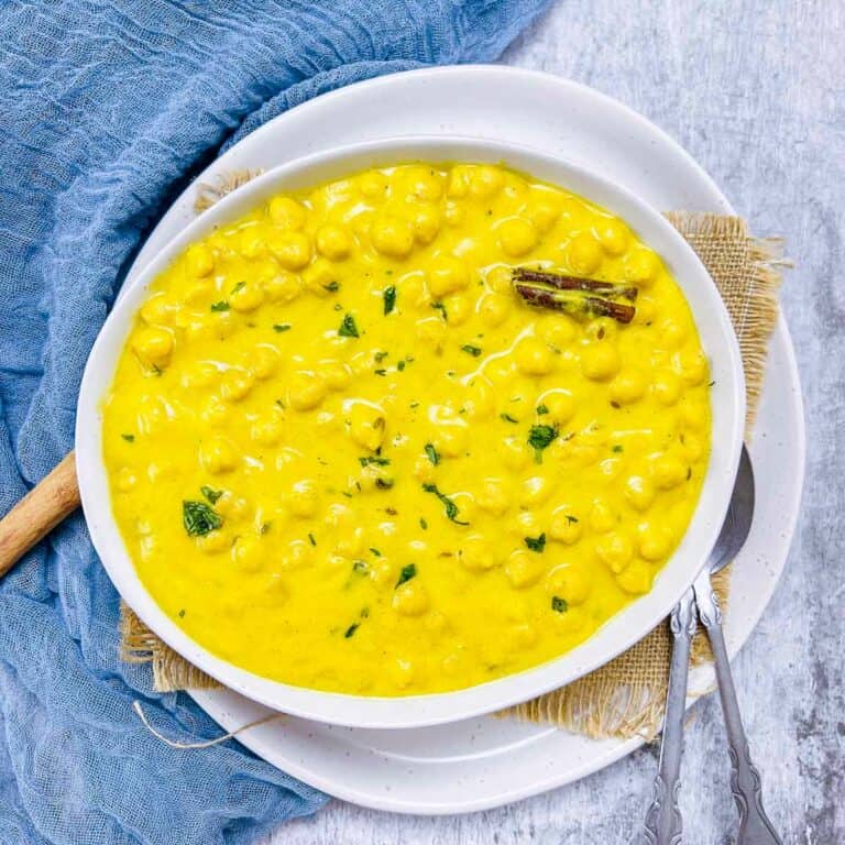 Chana madra in a white bowl.