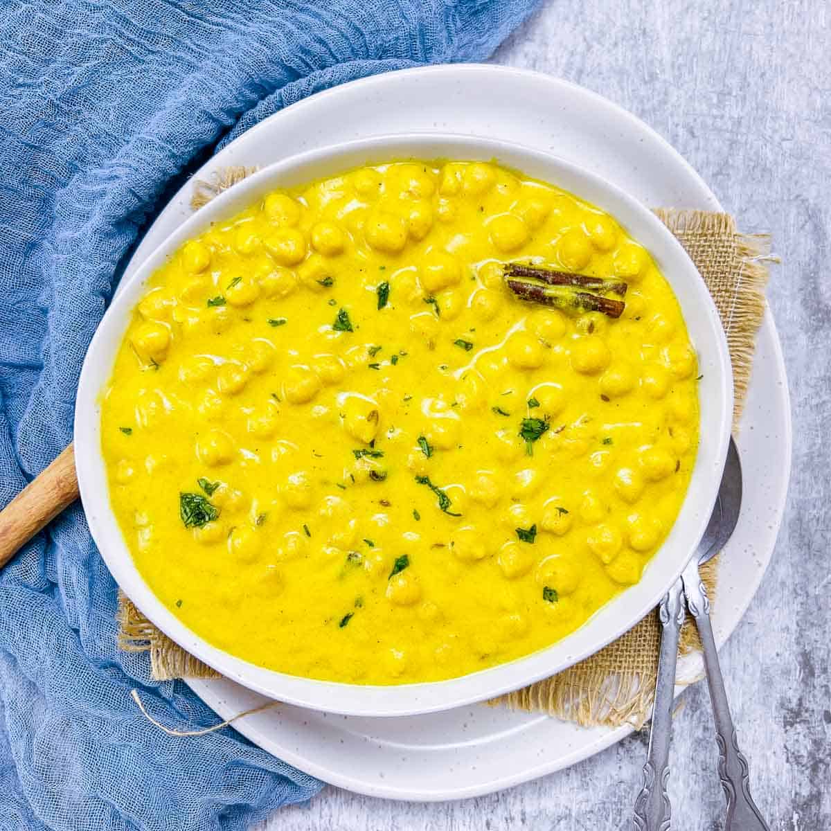 Chana madra in a white bowl.