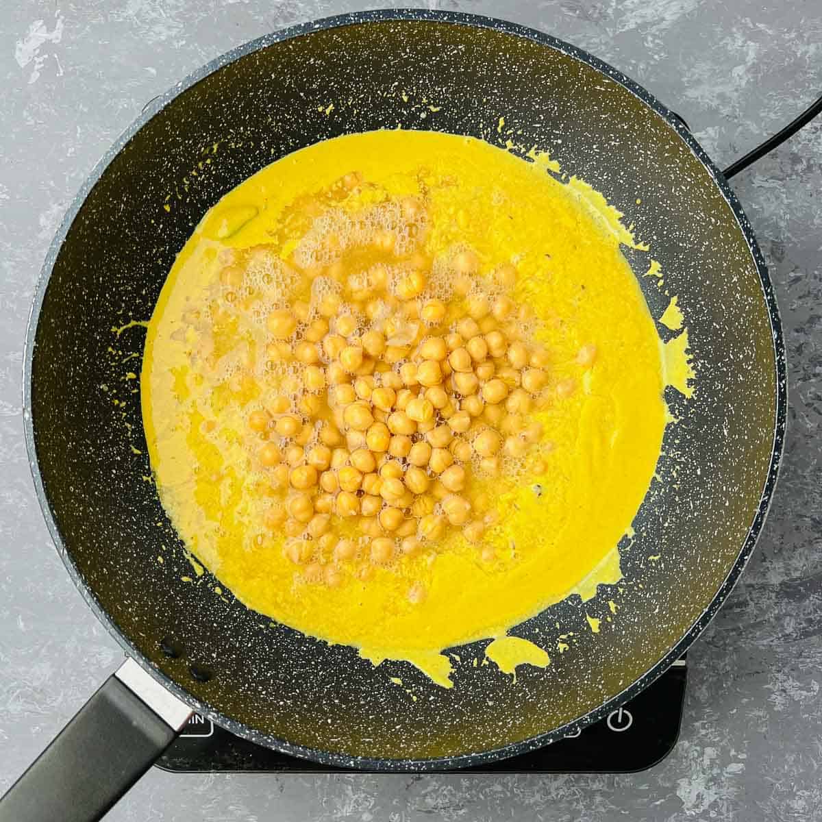 Boiled chickpea and water added to yogurt sauce.