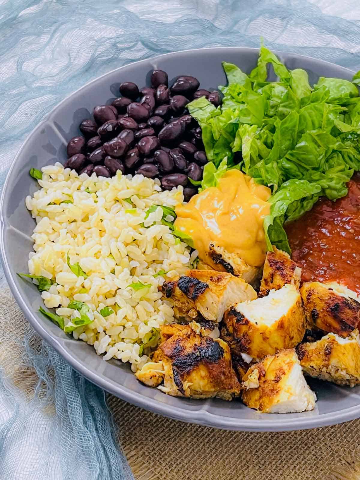 Diced chicken pieces in the burrito bowl.