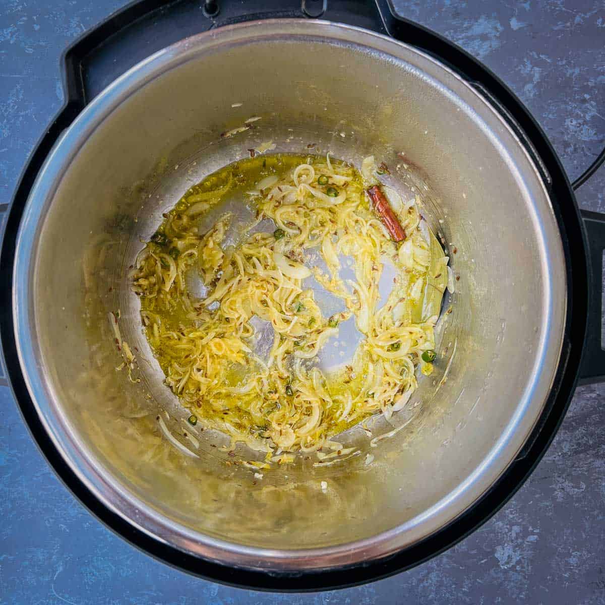 Sauted onion and spices in Instant Pot.