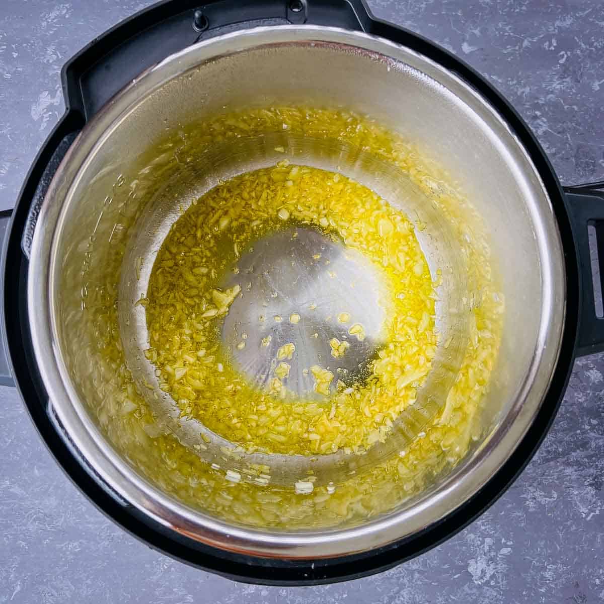 Sauted onion and garlic in Instant Pot.