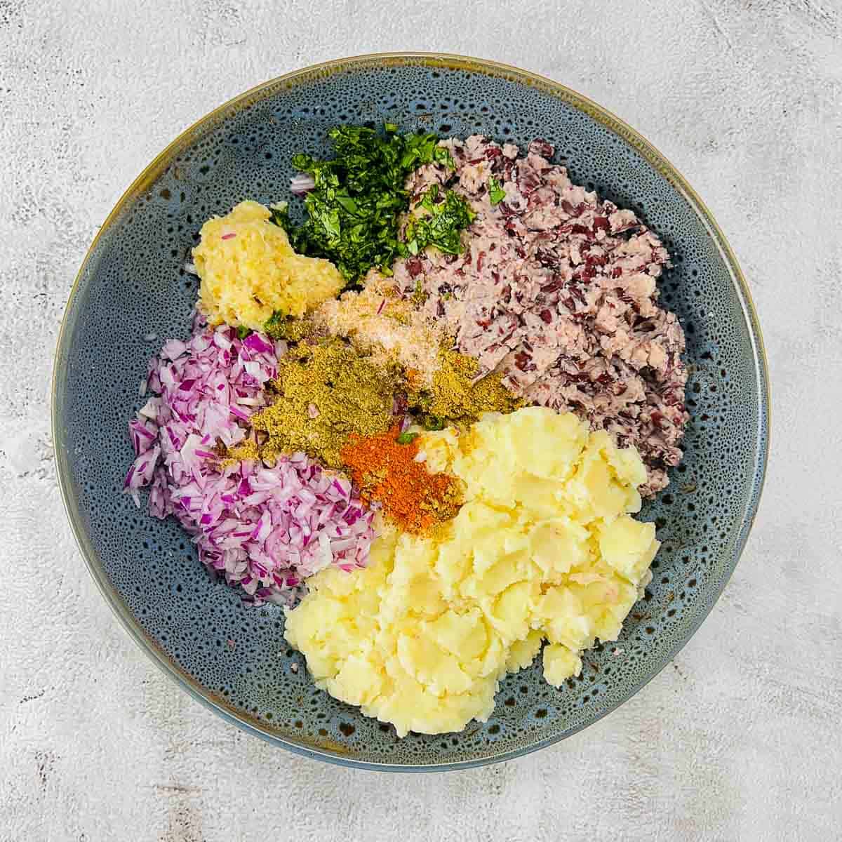 All patties ingredients placed in a mixing bowl.