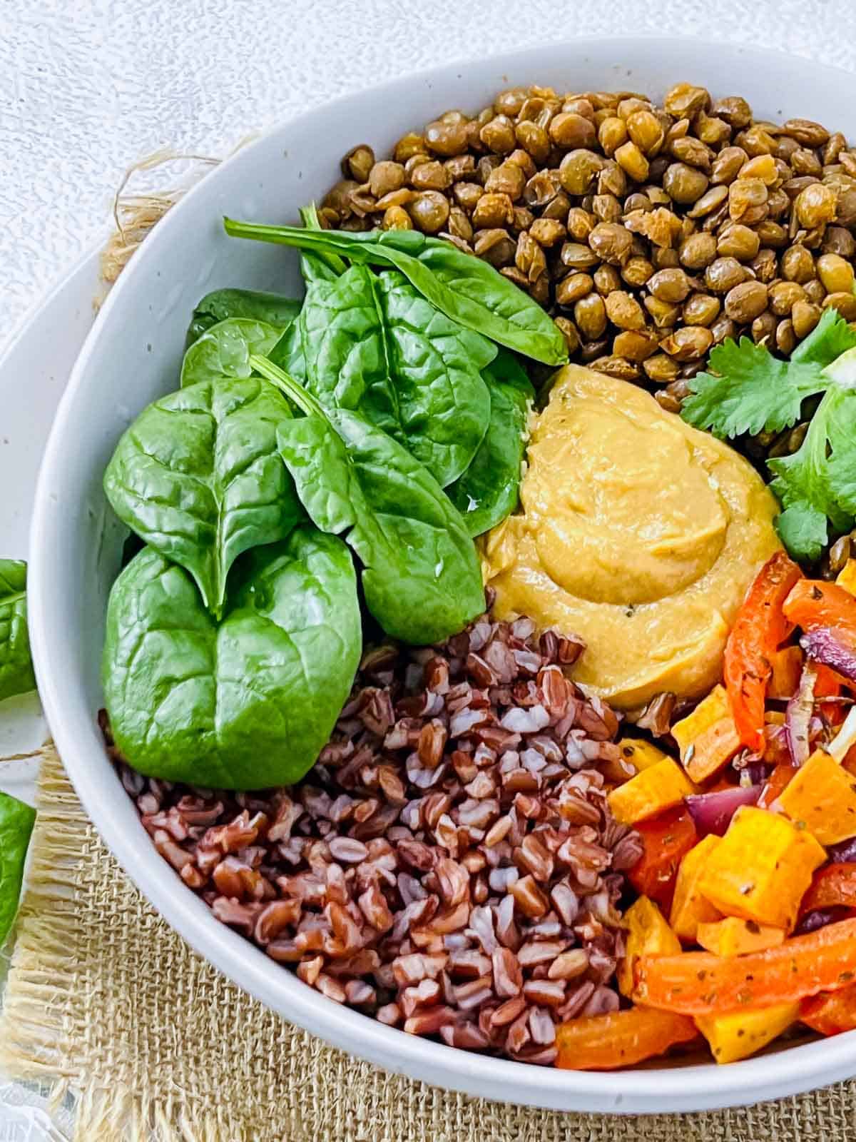 Lentil buddha bowl elements in a bowl.
