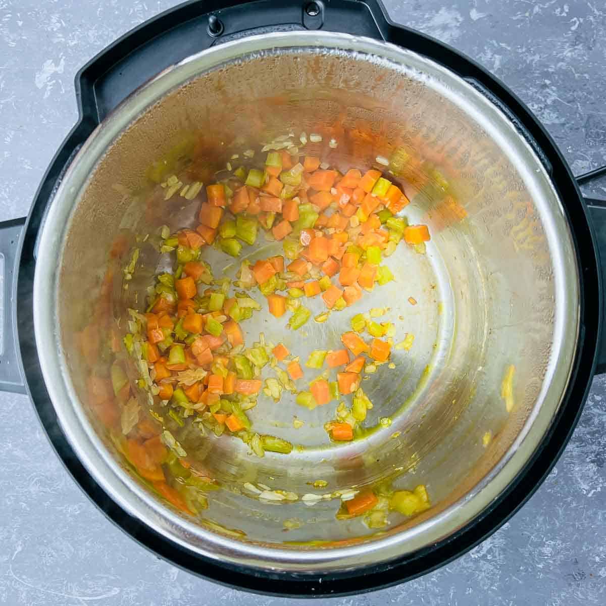 Sauted onion, carrots, and celery in the Instant Pot.