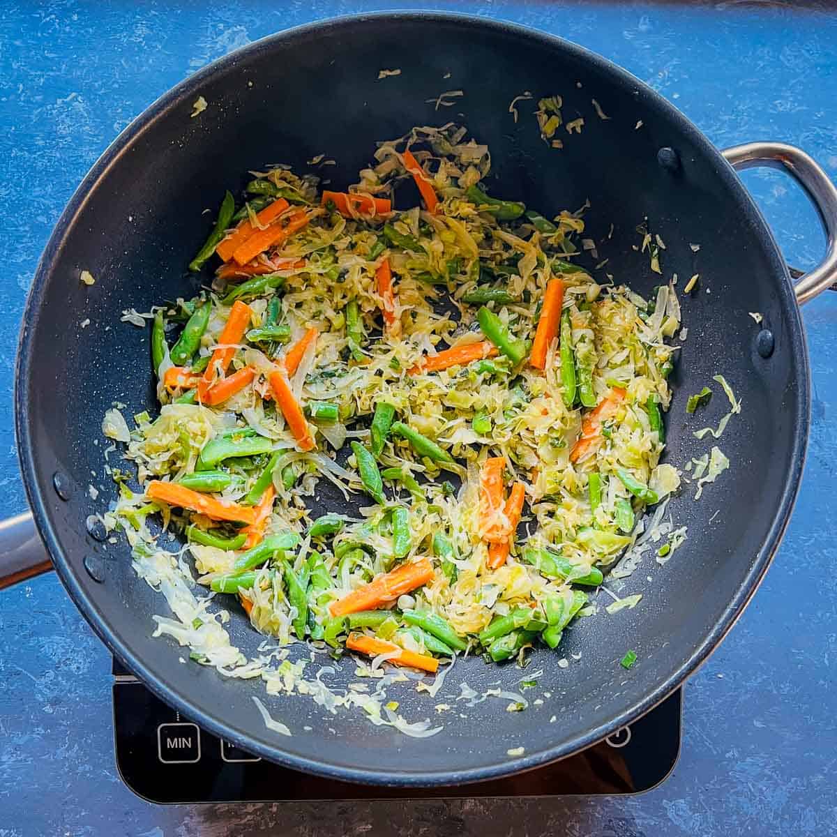 Sauted veggies in the frying pan.