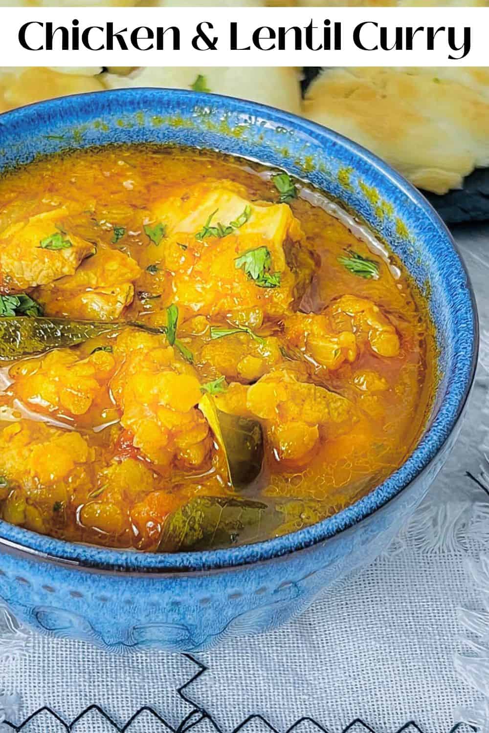 Chicken lentil curry served with naan bread.