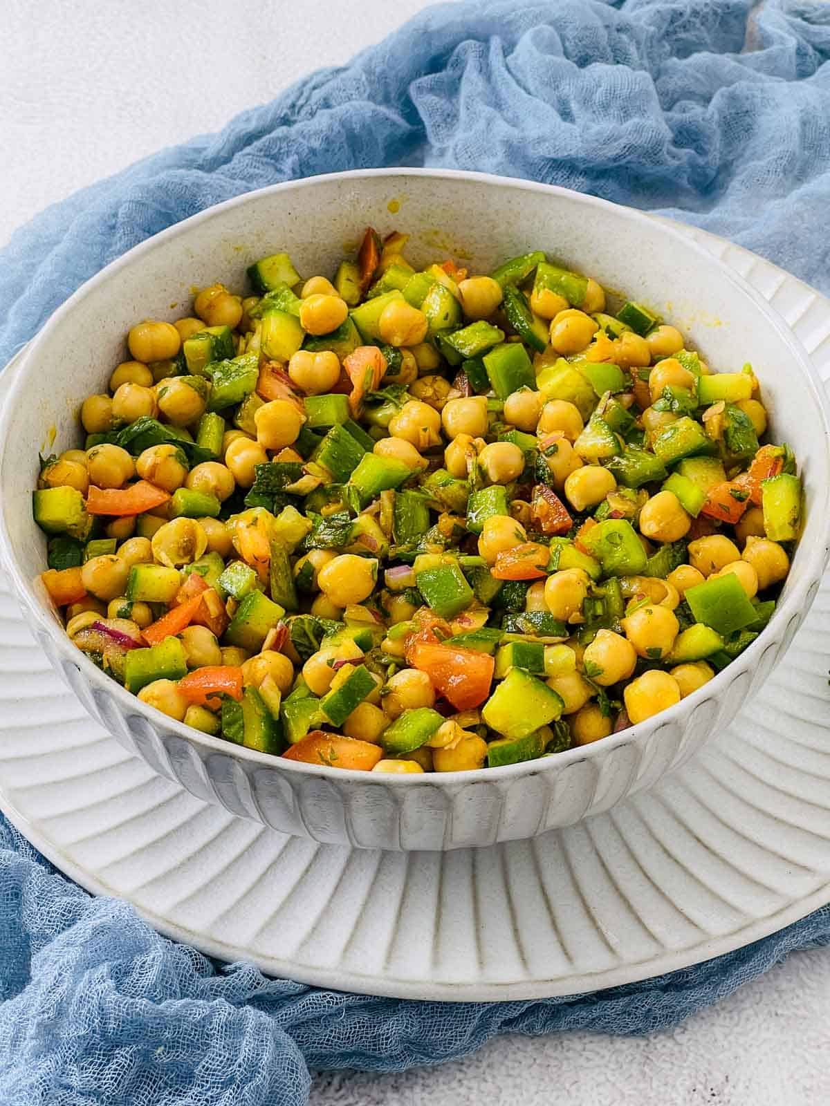 Moroccan chickpea salad in a white bowl.