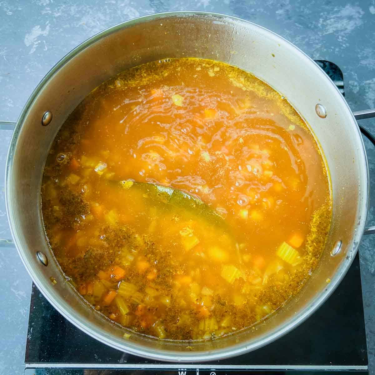 Soup simmering in the pot.