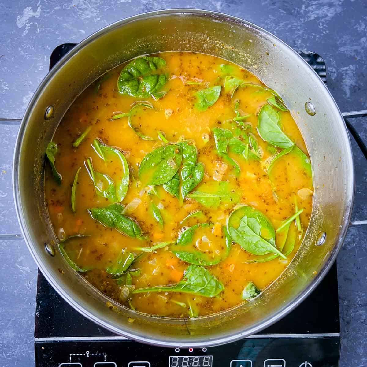 Spinach added to the soup.