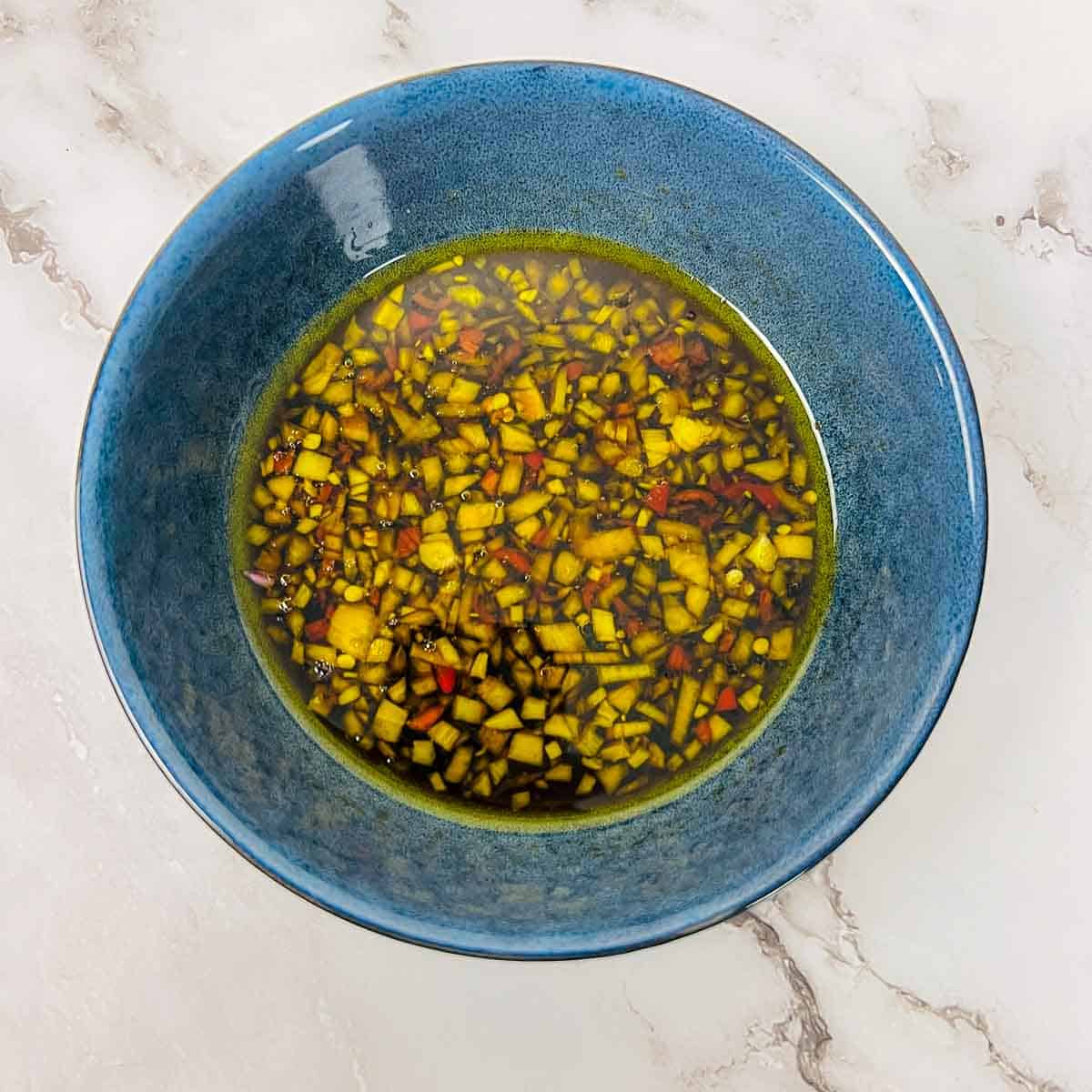Dipping sauce whisked in a small bowl.
