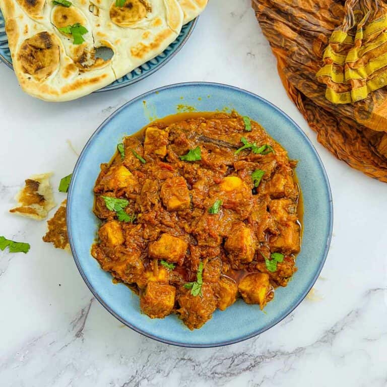 Chickpea tofu tikka masala served with naan bread.