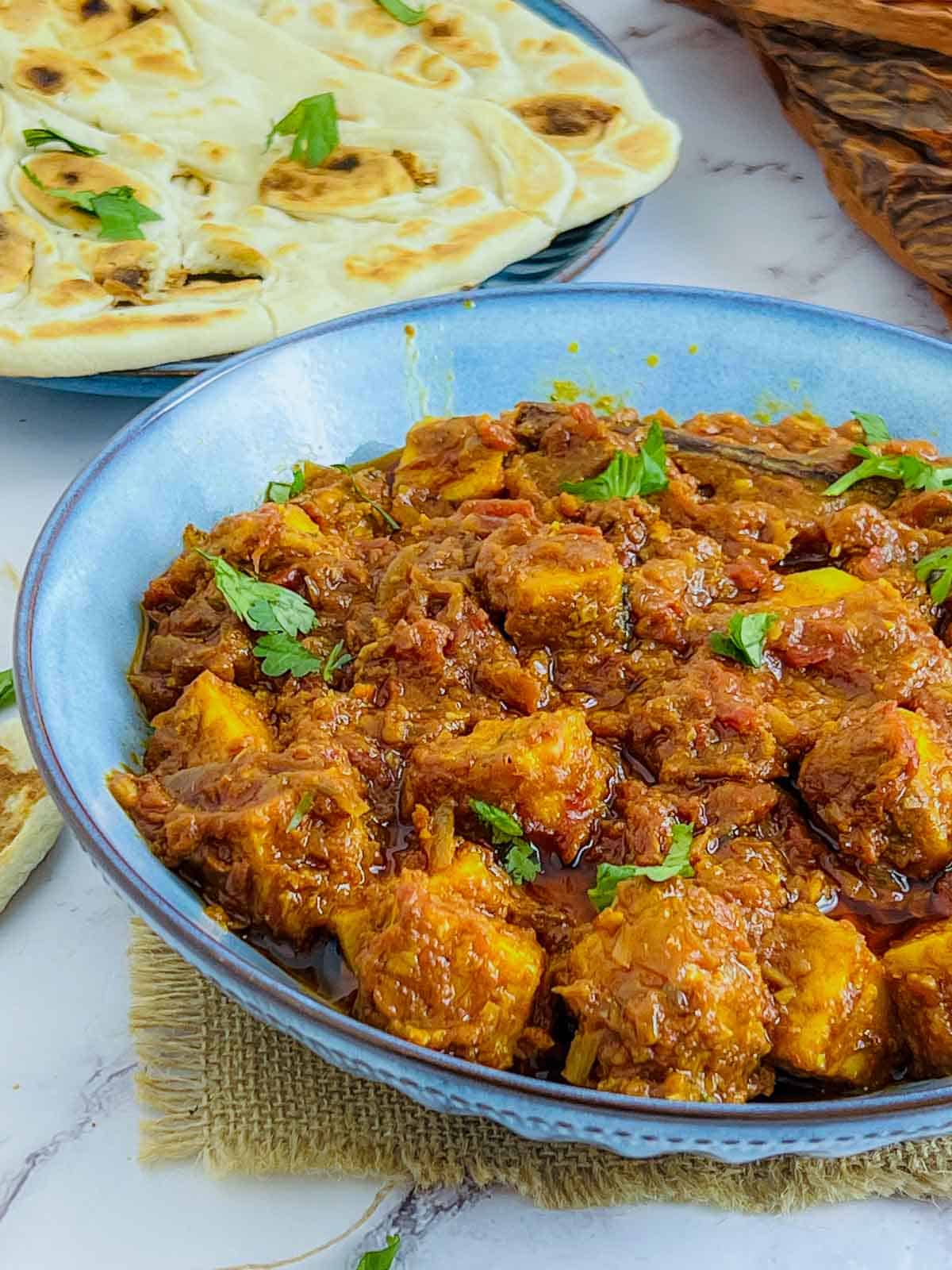 Chickpea tofu masala garnished with cilantro.