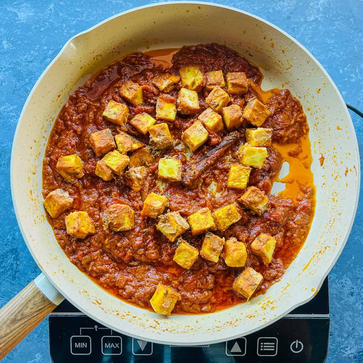 Roasted chickpea tofu simmered in tikka masala sauce.