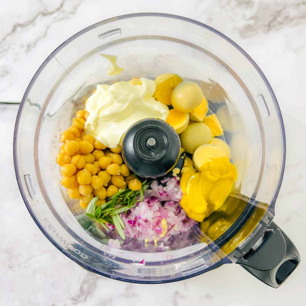 Yolks and remaining ingredients placed in the food processor.