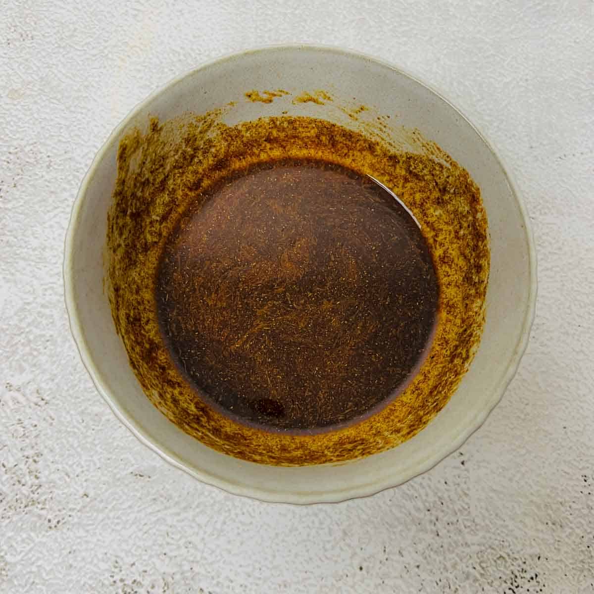 Prepared dressing in a small white bowl.