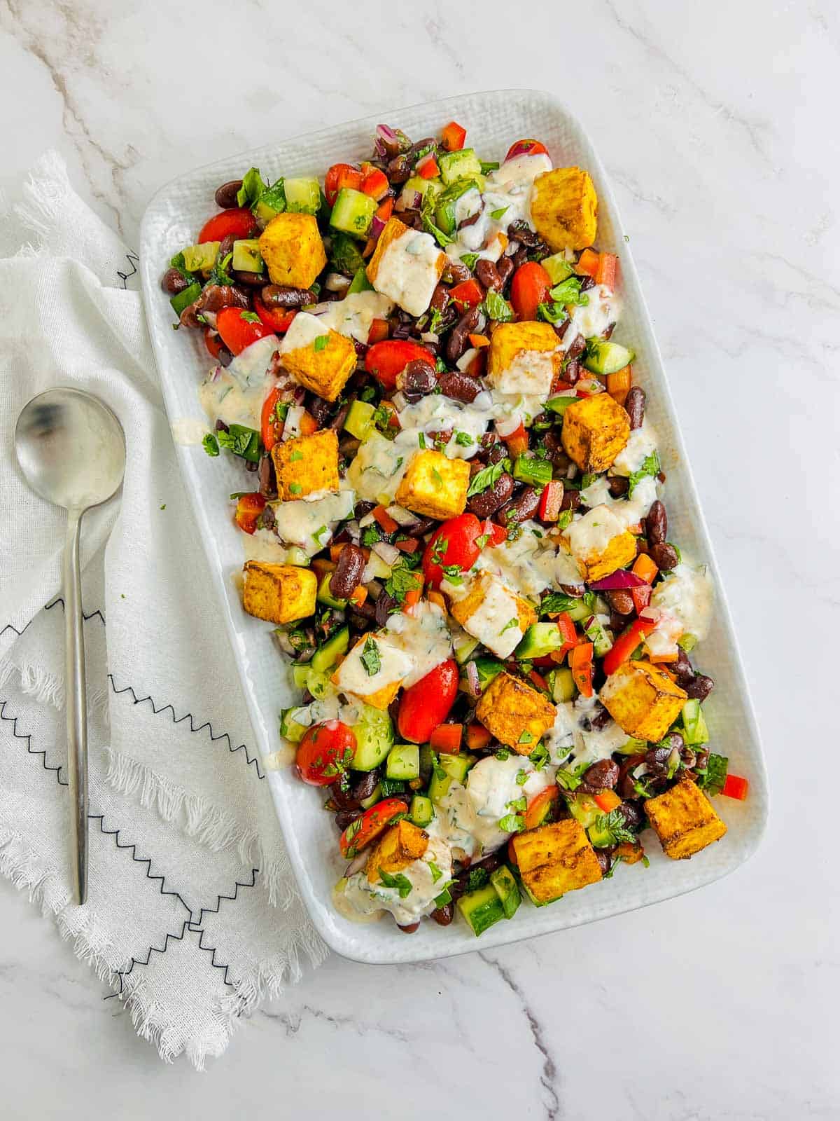 Paneer rajma salad served on a white plate.