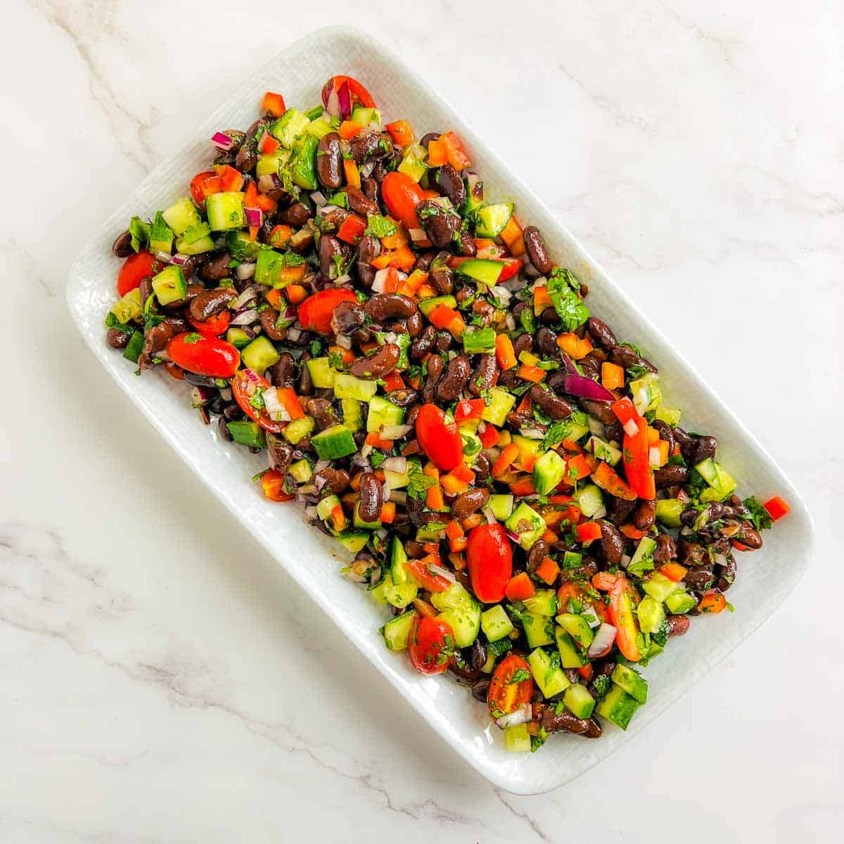 Veggies and beans on a serving plate.