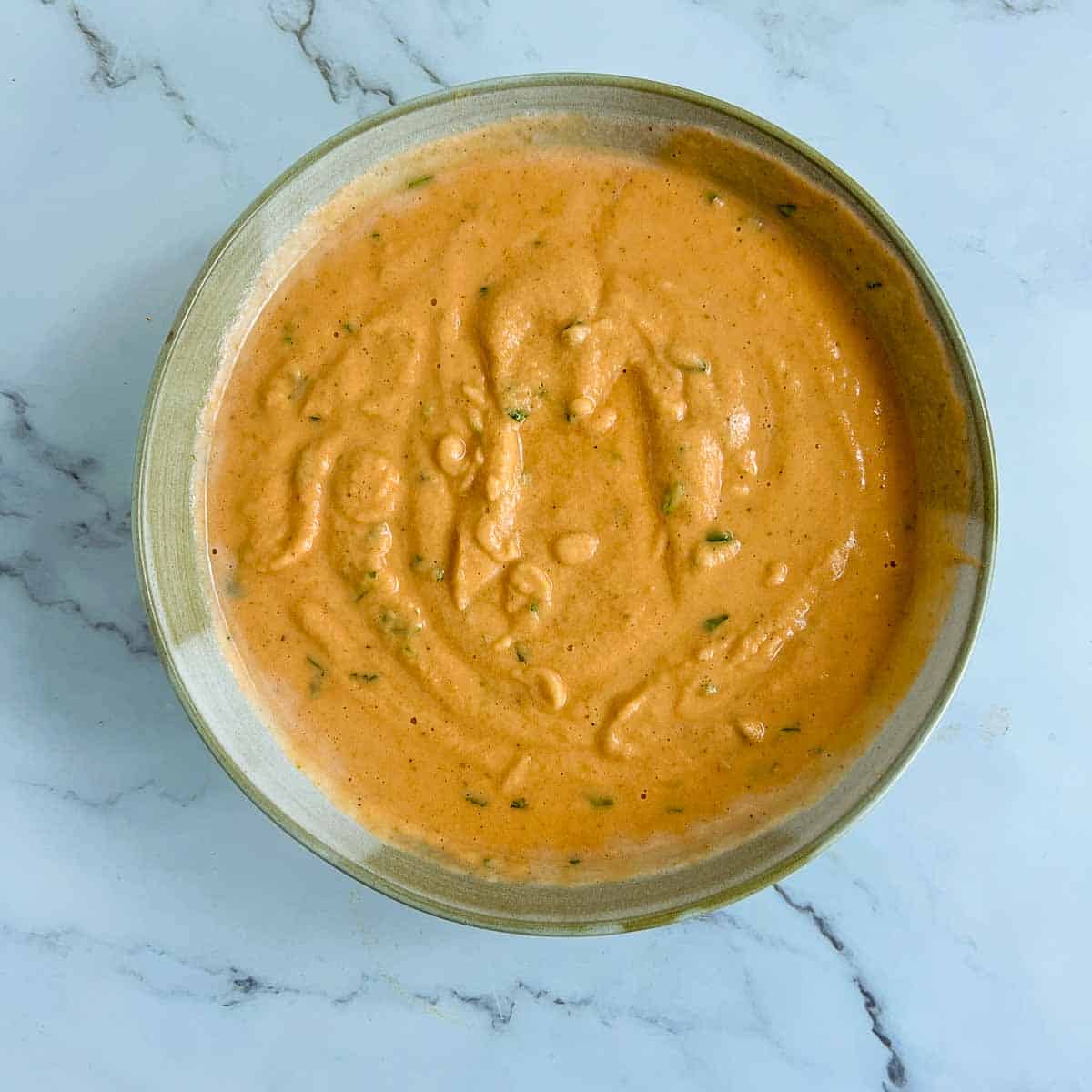 Ground batter in a wide bowl.