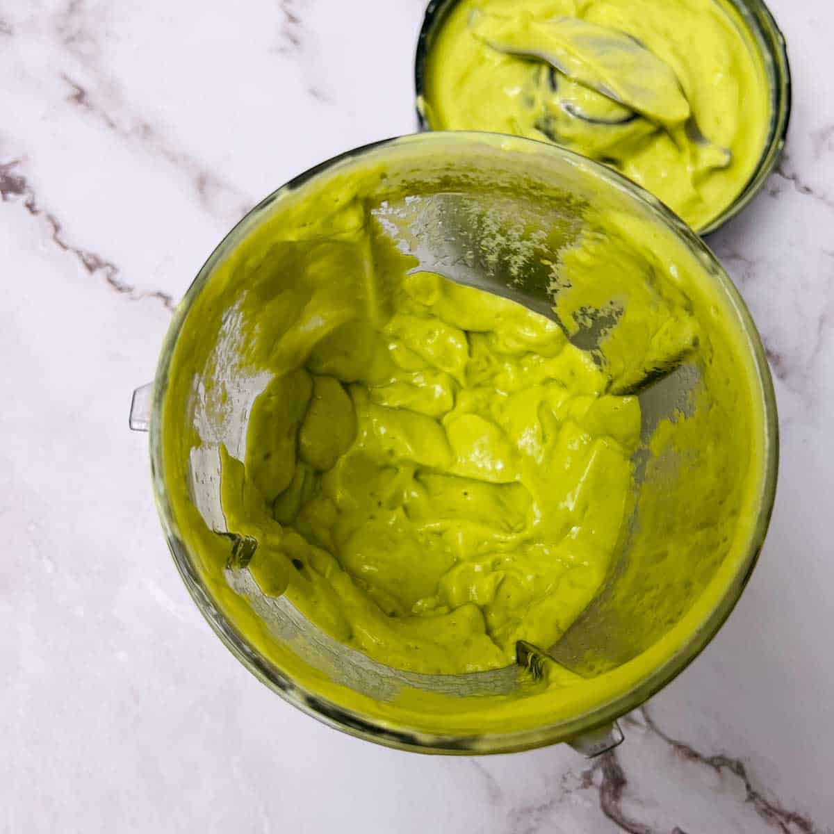 Avocado dressing in a blender jar.