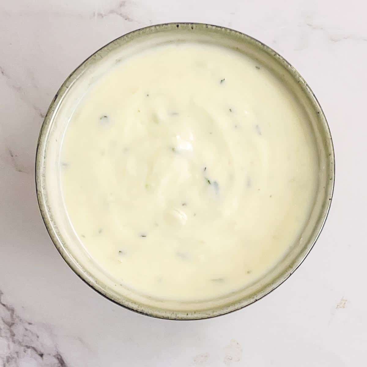 Cucumber raita in a small bowl.