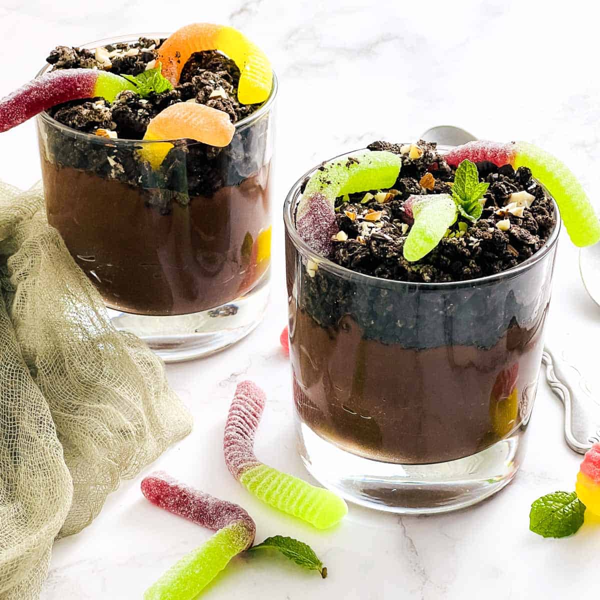 Two small glasses of chocolate dirt pudding.