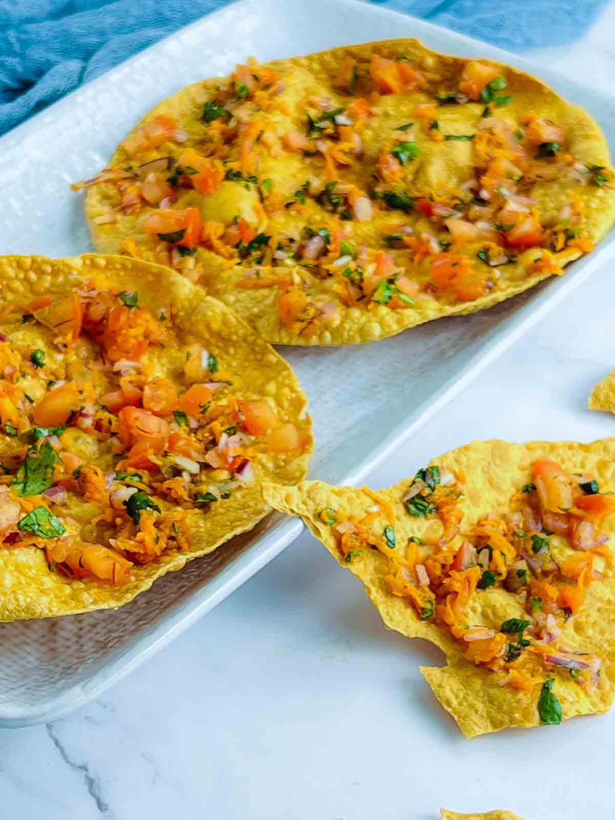 Masala papad on a serving plate.
