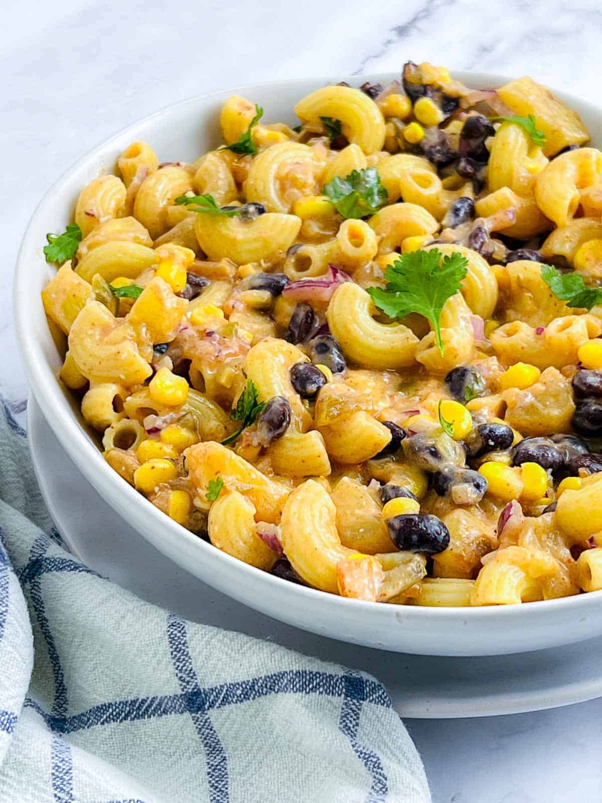 Mexican macaroni salad garnished with fresh cilantro.