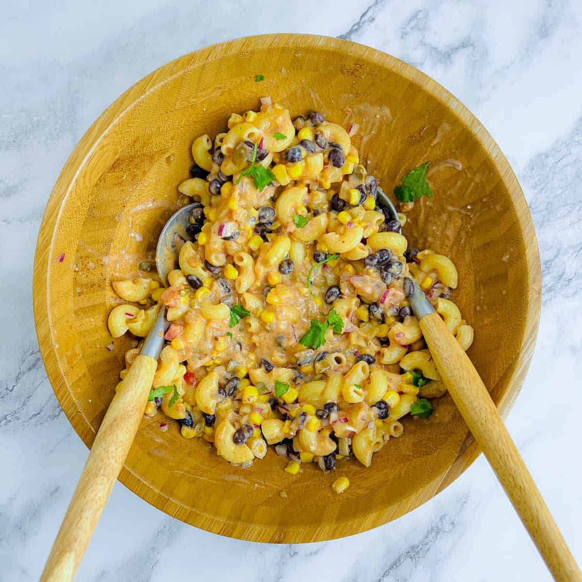 Dressing tossed with pasta and beans.