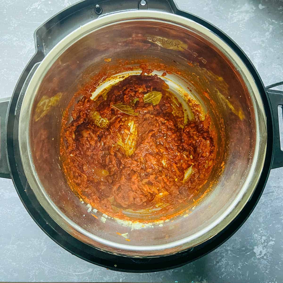 Cooked tomatoes and spices in the Instant Pot.