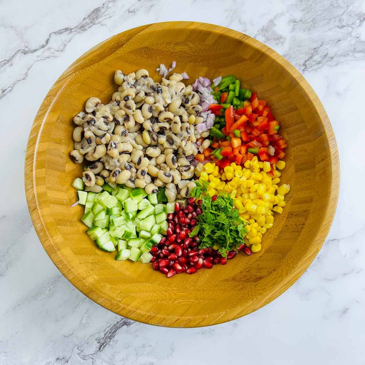Veggies and beans in a mixing bowl.