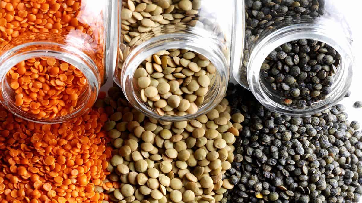 Lentils Spilling from glass jars.