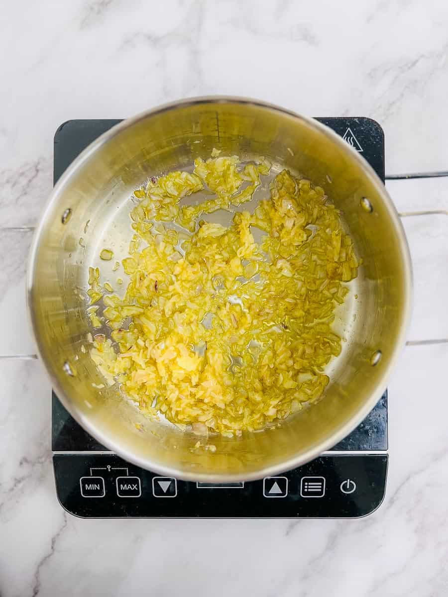 Sauted onion and garlic in the pot.