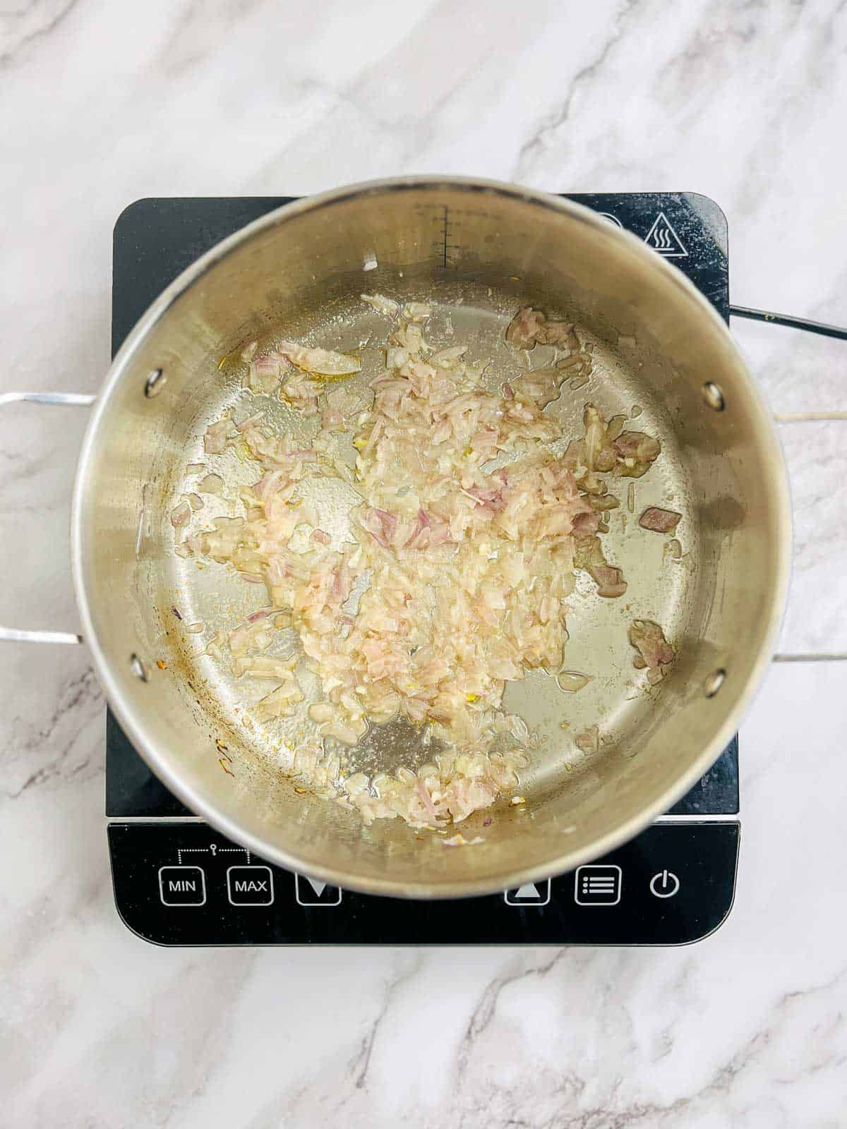 Sauted onion, ginger, and garlic in a large pot.