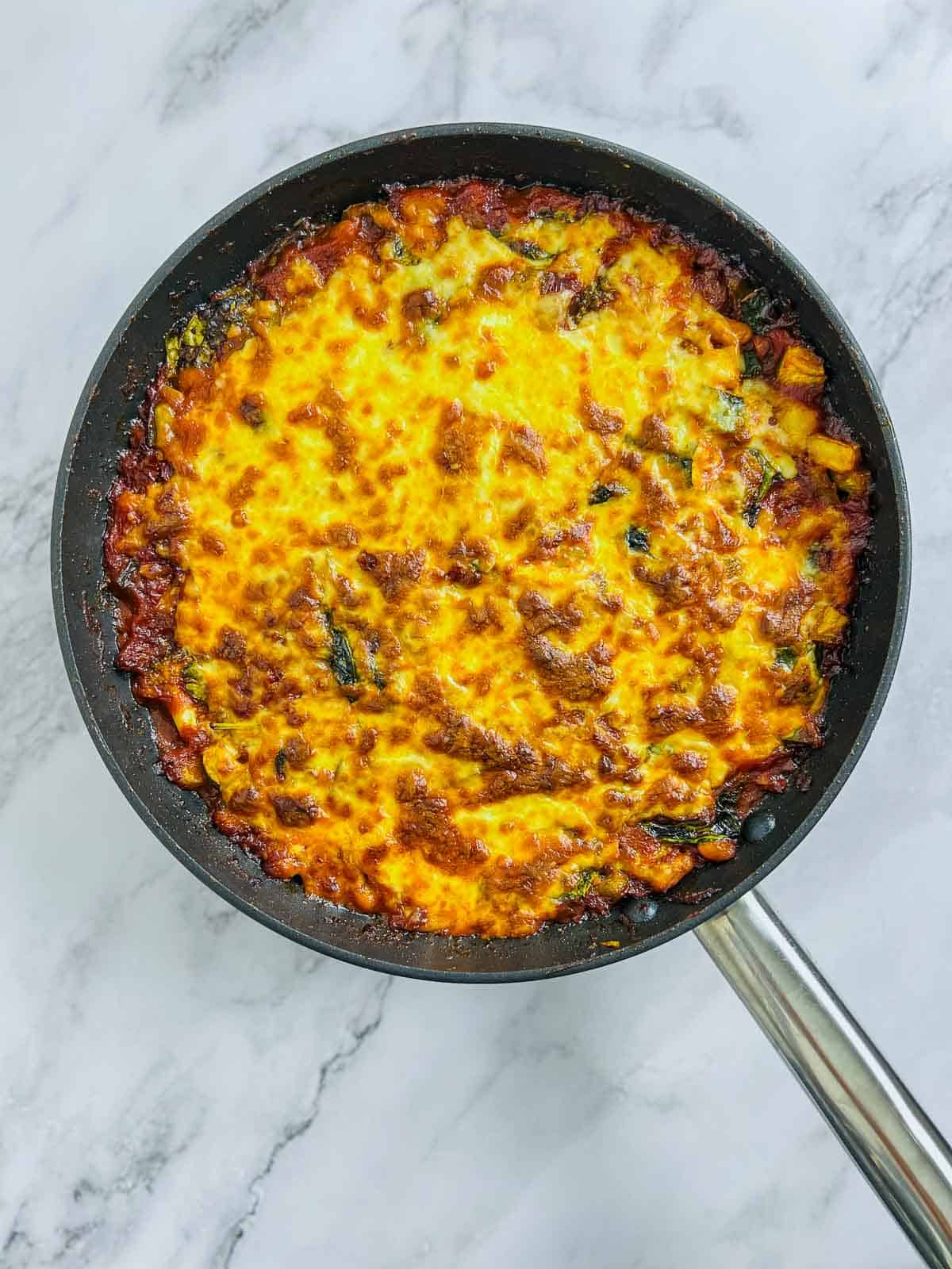 Molten and bubbly cheese on the tomato bake.