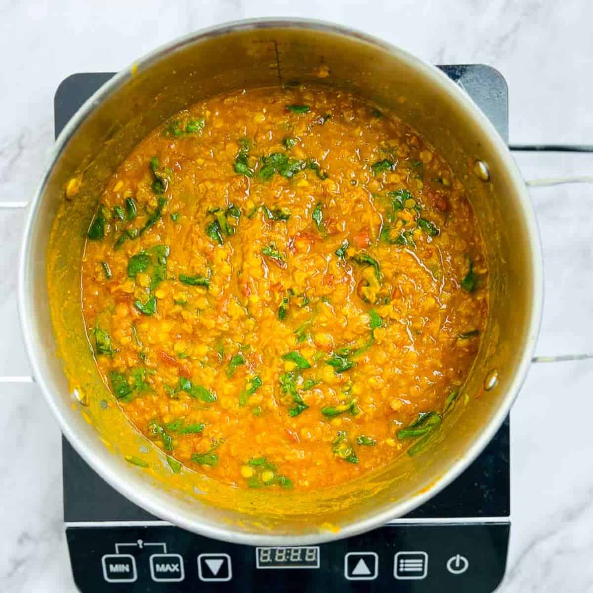 Spinach cooked in the dal.