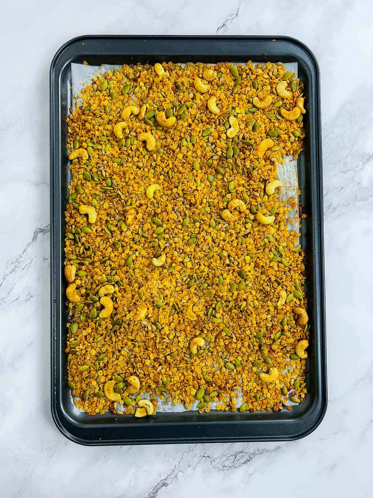 Baked lentil granola on the baking sheet.