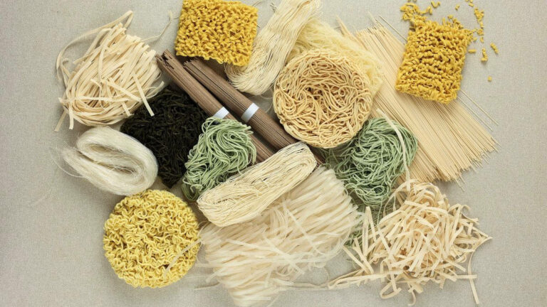 Different types of noodles on a table.