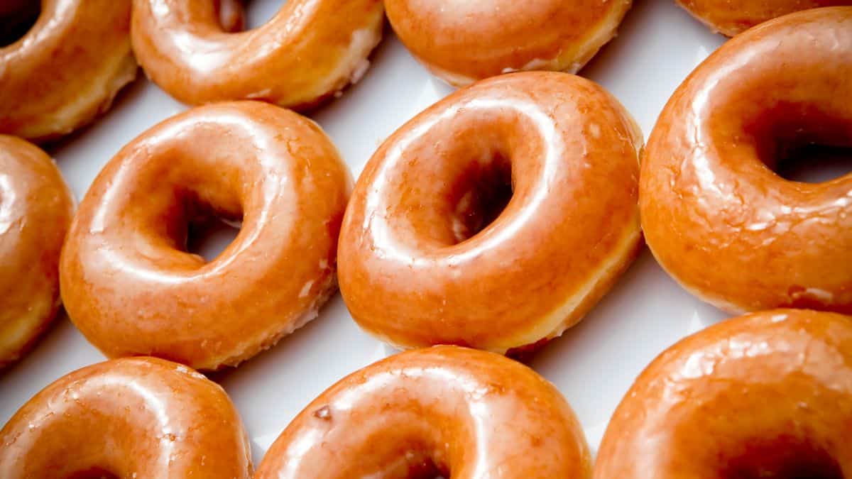 Glazed doughnuts on a white surface.
