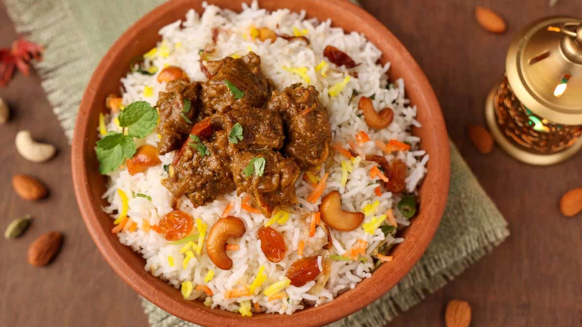 Palakkad prawn biryani in a clay pot.
