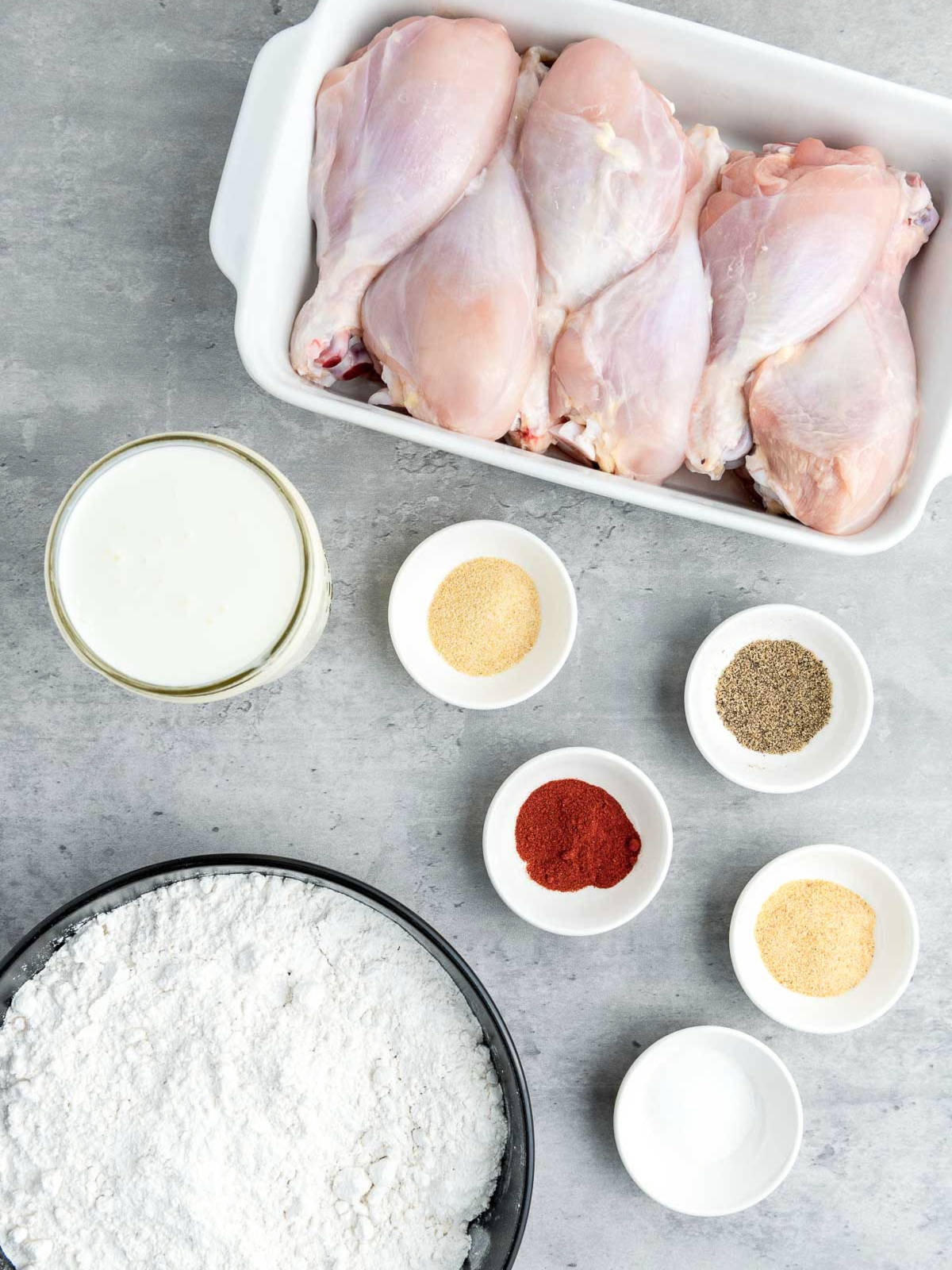 Ingredients placed on a grey surface.
