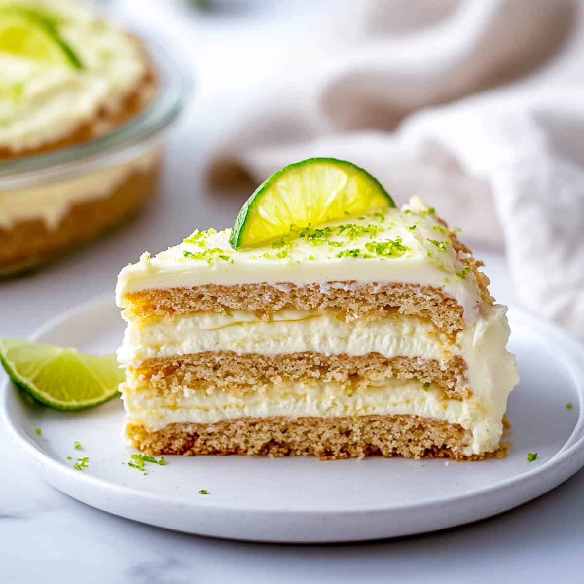 A slice of Mexican lime icebox cake on a white serving plate.