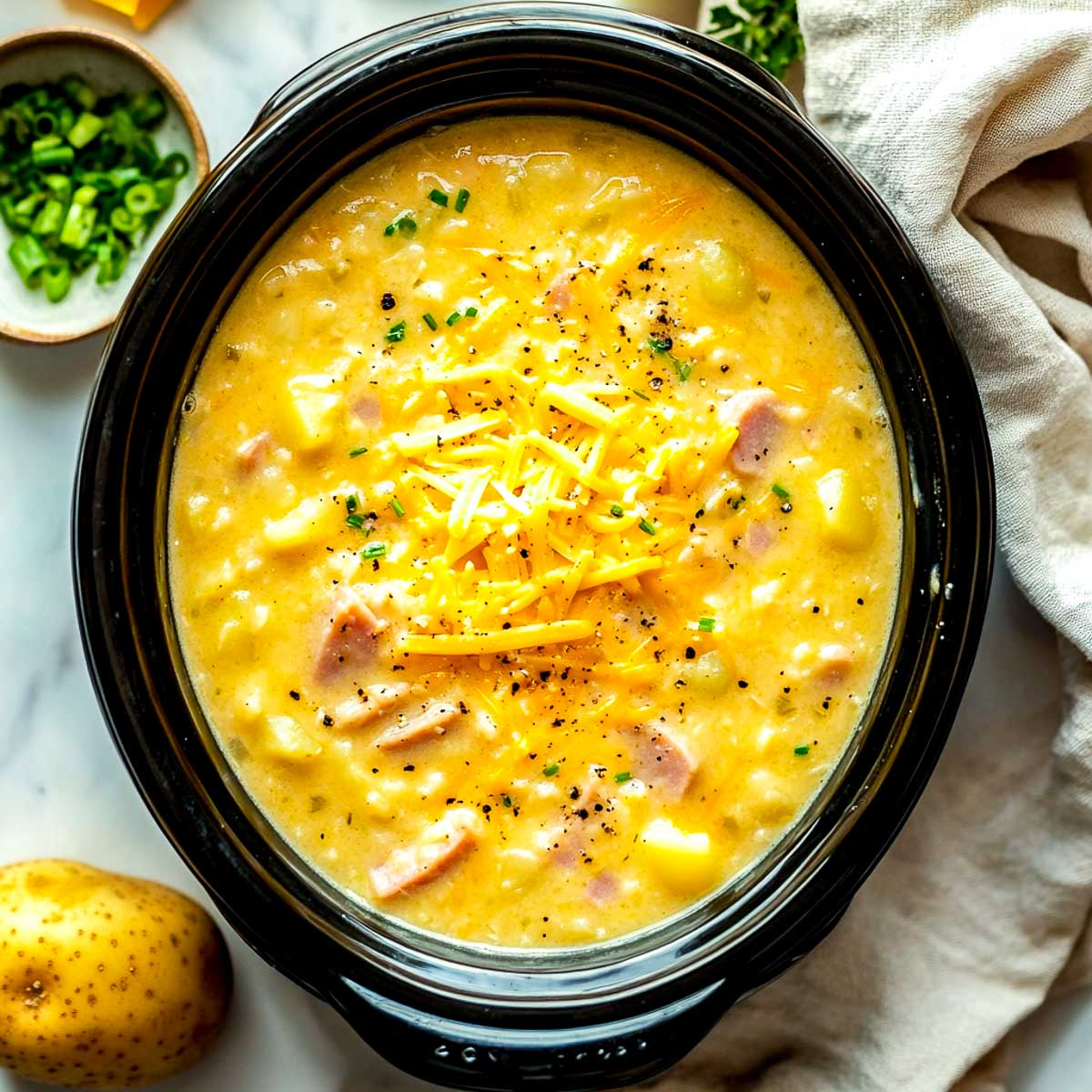 Cheesy ham potato soup made in a crockpot.