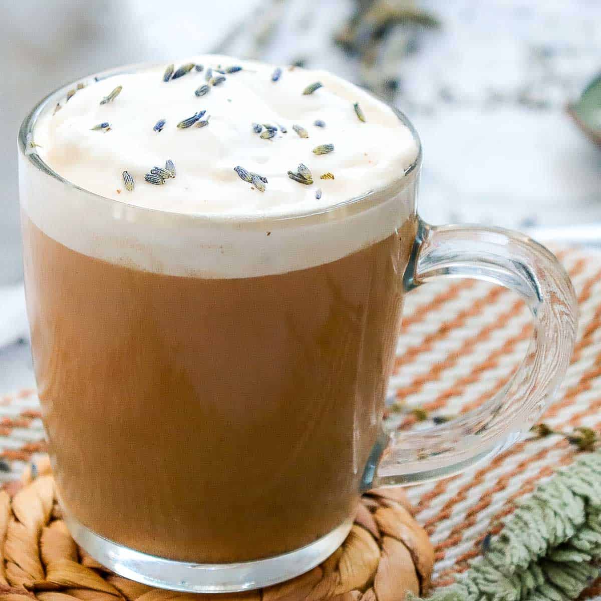 Side view of a glass of London fog latte.