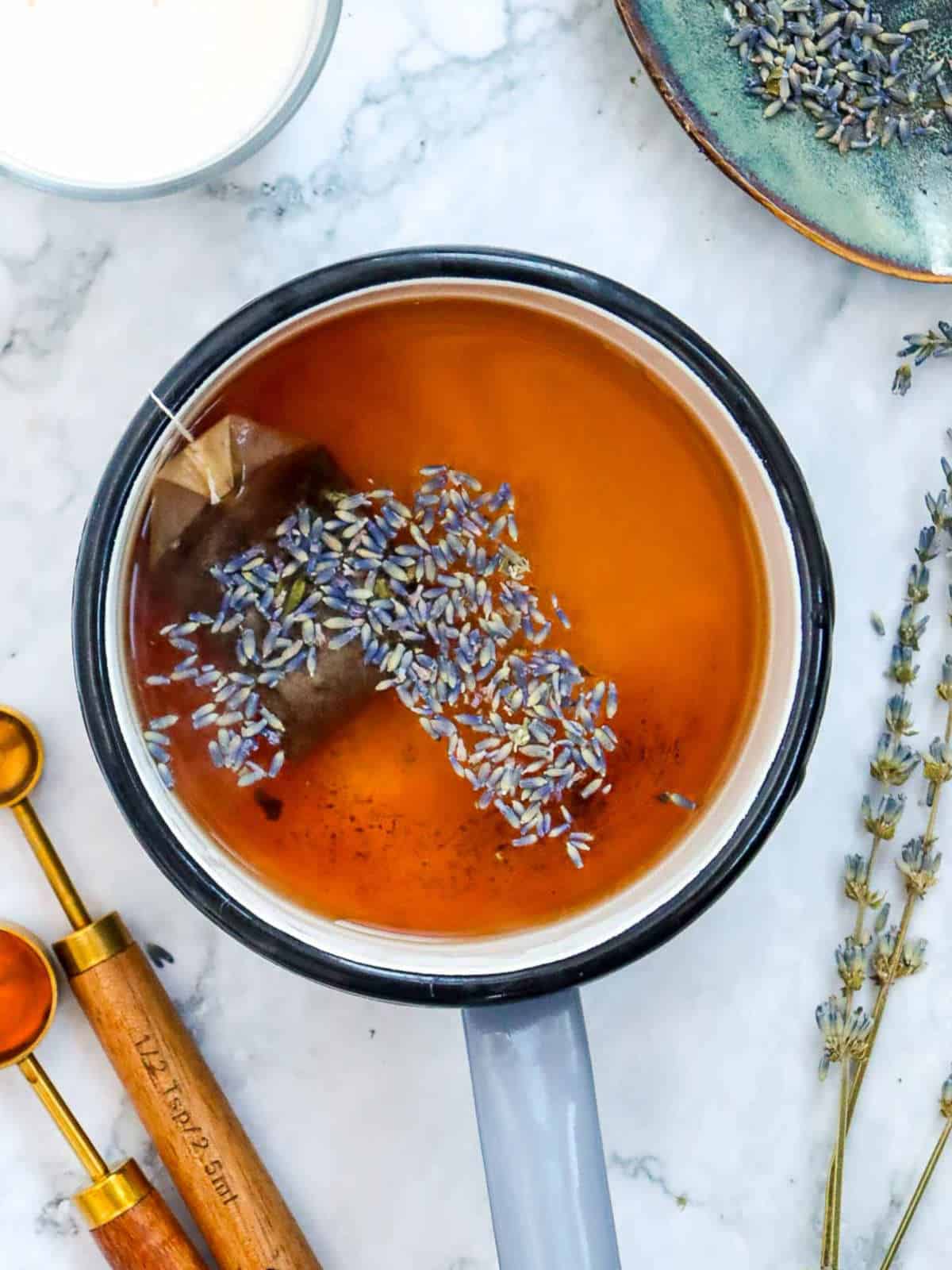 Earl grey tea brewed in a saucepan.