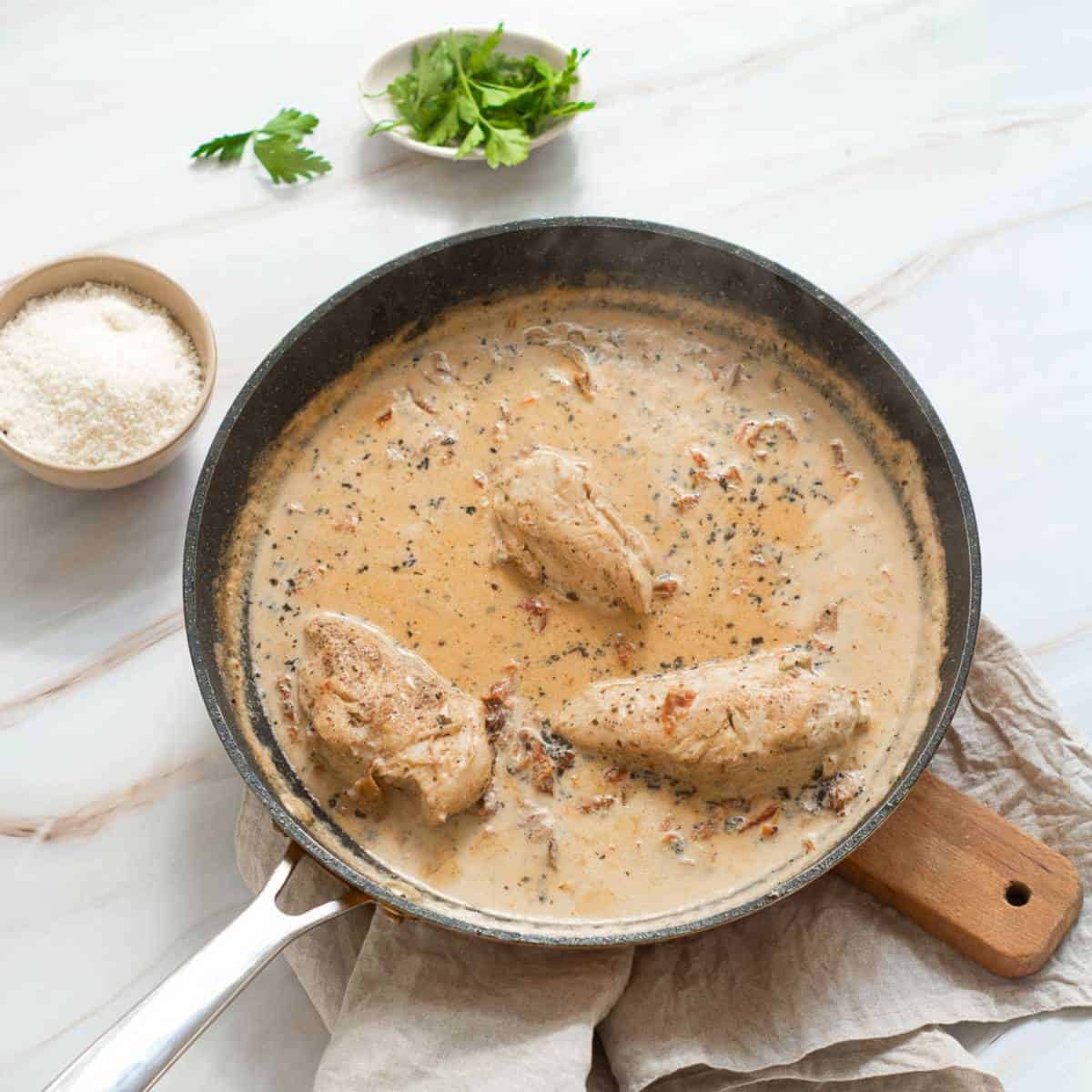 Cooked chicken in the skillet.
