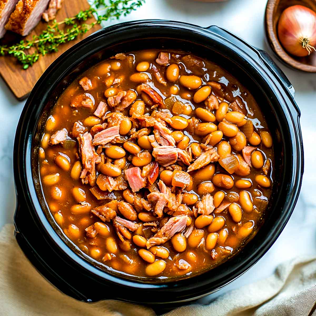 Pinto beans and ham cooked in a crockpot.