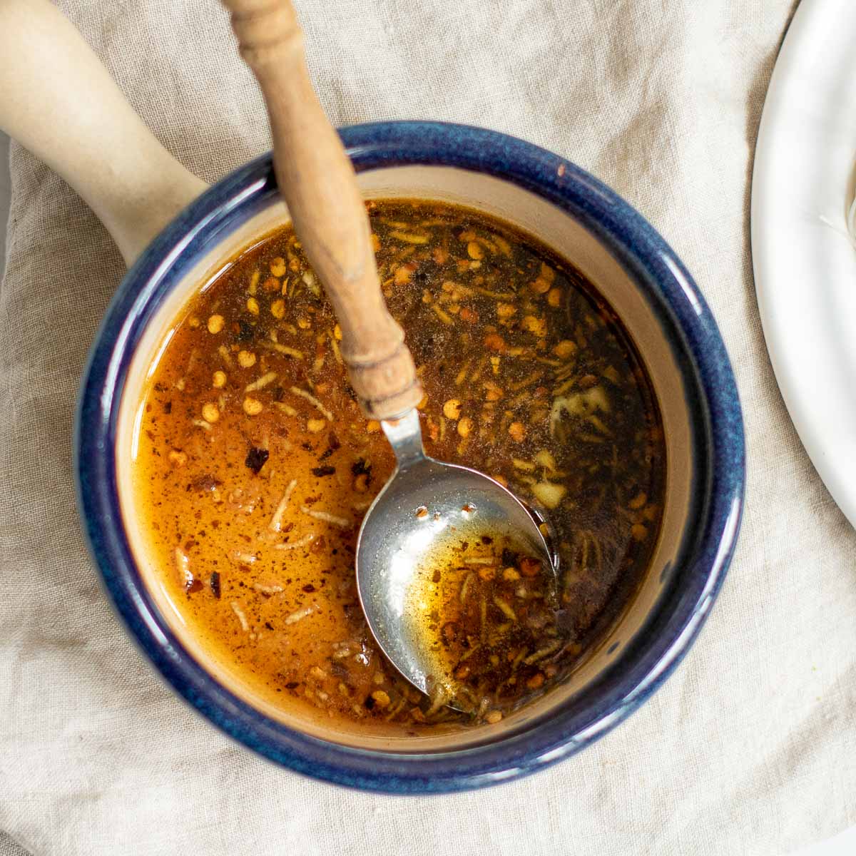 Garlic-chili sauce cooked in a saucepan.