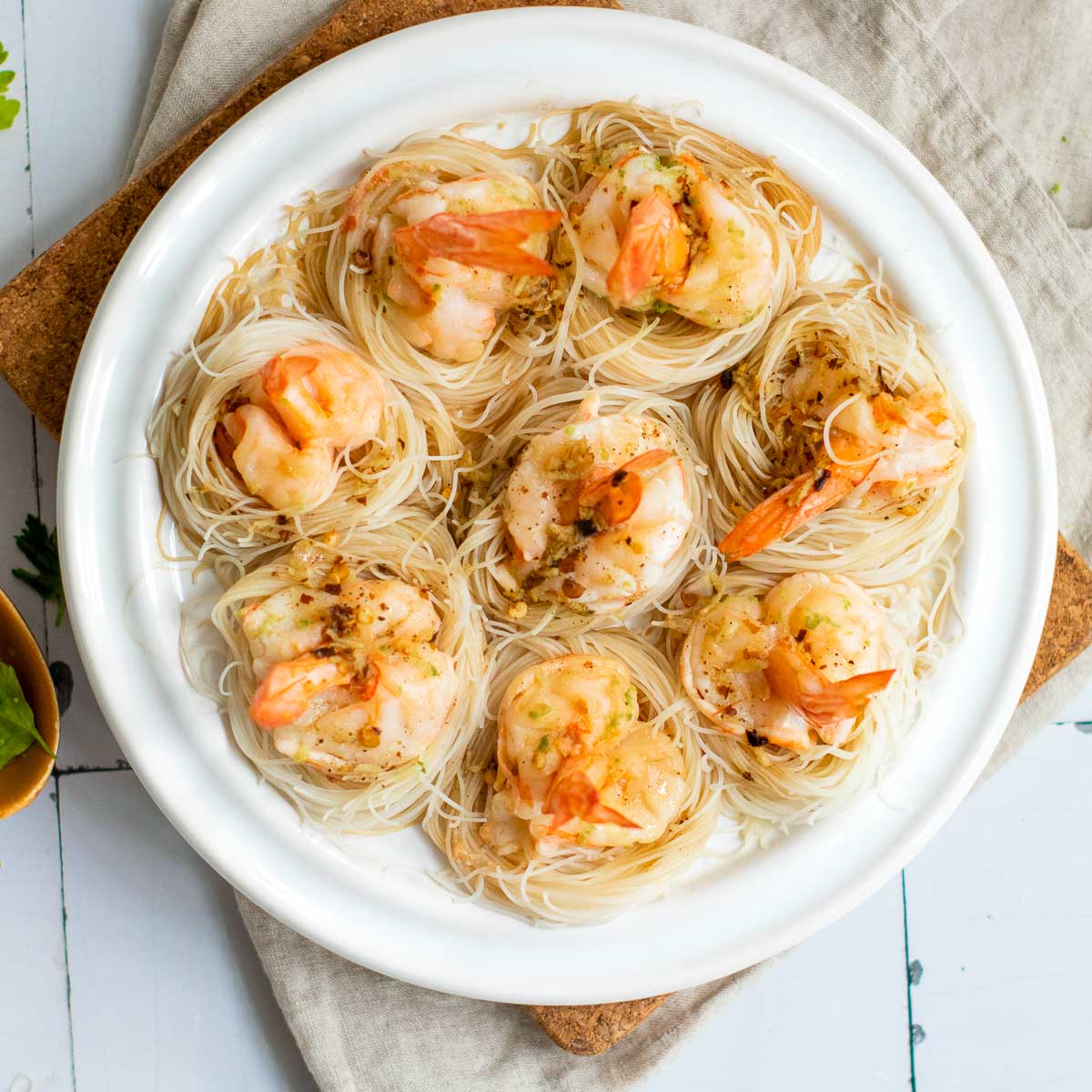 Steamed shrimp on a white plate.