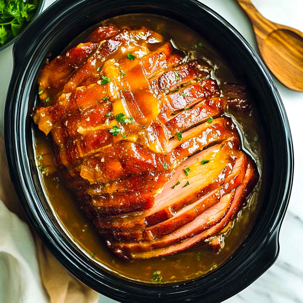 Spiral ham with maple glaze made in crockpot.